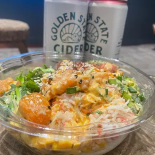 a bowl of food and a can of beer