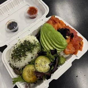 Half half bowl with salmon and tuna with lava sauce and half rice half salad + added avocado. 10/10