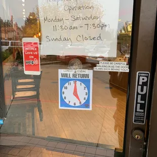 a closed door with a sign on it