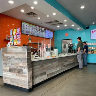 a man and a woman standing at a counter