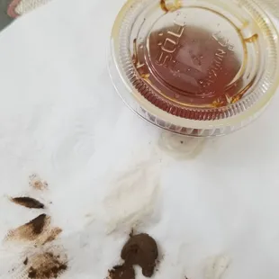 a cup of coffee and a dirty napkin