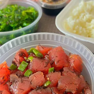 a bowl of meat and vegetables on a table