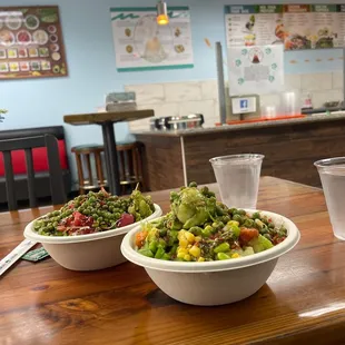 two bowls of food on a table