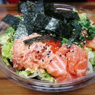 Spicy tuna and salmon over salad base and miso toppings