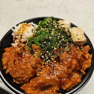 Double scoop spicy ahi on sushi rice with tofu, seaweed, and crab salad