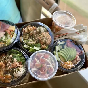 a person holding a box of food