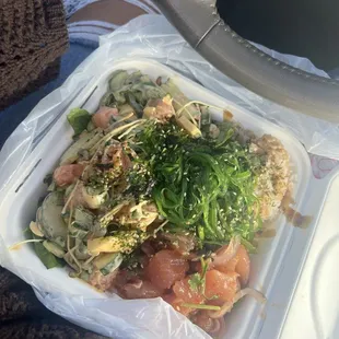 Poke bowl with half mixed greens/ half white rice, salmon, marinated albacore, and almost all the toppings lol.