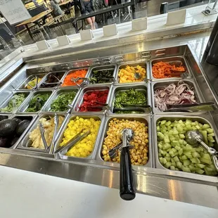 a variety of salads in a buffet