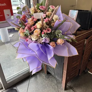 a bouquet of flowers in front of a door
