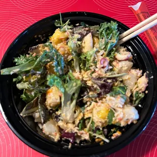 Medium poke bowl. With spring mix base, 3 proteins are spicy crab, scallops, &amp; octopus.  Sauces are spicy mayo &amp; house green sauce.