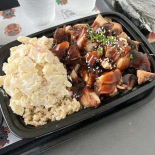 a meal of rice, meat, and vegetables
