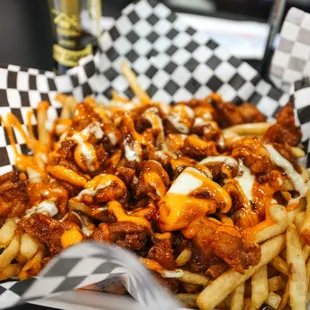 a basket of fries and a beer