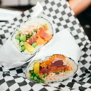 two burritos on checkered paper