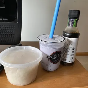 Taro Milk Tea size comparison with their side of sushi rice and a soy sauce bottle.