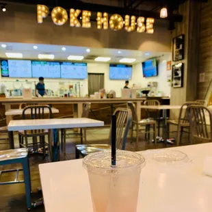 a drink in a plastic cup on a table