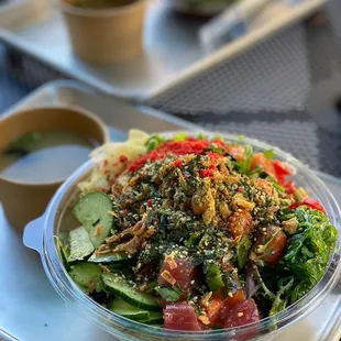 a bowl of salad on a tray