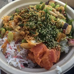 Scallop, octopus, and spicy tuna with crab salad, seaweed salad, edamame, furikake, and onions on rice.