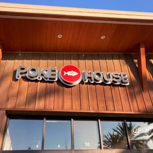 Poké House sign in sunset hours