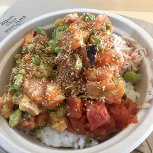 Custom bowl. Sushi rice, octopus, spicy tuna, salmon, sairacha aioli sauce, sesame seeds,edamame. So good