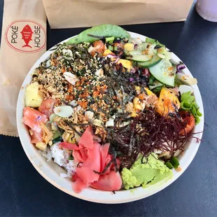 Medium bowl with tuna and two types of salmon, and all the toppings except for jalapeños. They had a hard time putting the cover on