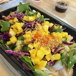 a salad in a plastic container