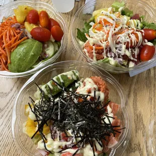 three bowls of food on a table