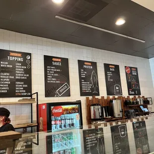 menus on the wall of a coffee shop