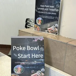 a poke bowl and a sign