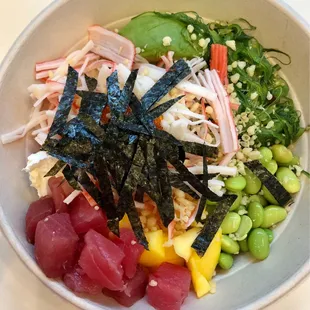 Custom Bowl (base, 1 protein, veggies, up to 3 sauces, toppings). You can add another protein for extra and avocado is extra