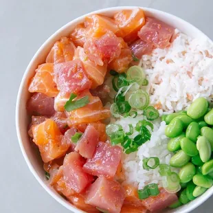 a bowl of rice, peas, and salmon