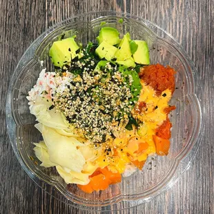 a bowl of food on a wooden table