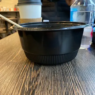 Mediocre food not worth the price. Hot ramen served in a plastic cup.