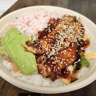 a plate of food with rice and avocado