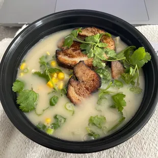 a bowl of soup and a laptop