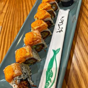 a sushi roll on a blue plate