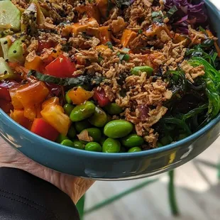 Poke bowl with rice and spicy tofu