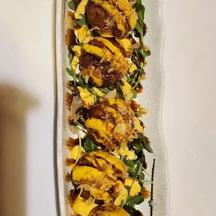 a long platter of food on a table