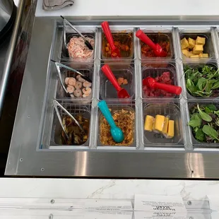 a variety of food in plastic containers