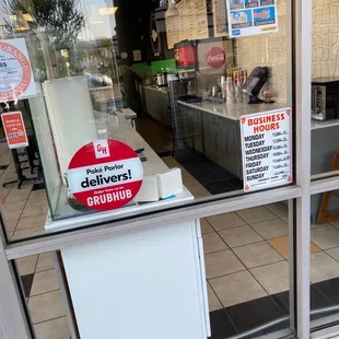 a sign in the window of a fast food restaurant