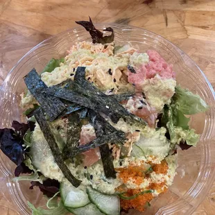 a salad in a plastic bowl