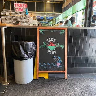a chalkboard sign in a restaurant