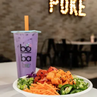 a bowl of food and a drink