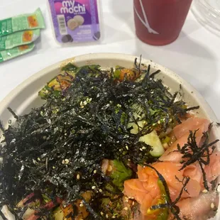 Poke Regular Bowl with rice, salmon and spicy salmon and  a huge amount of toppings, drink and Mochi