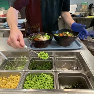 7/26/23 He&apos;s carefully &amp; systematically creating my poke bowl