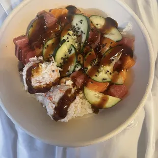 A bunch of imitation Krab, ton of cucumber, and a few measly little squares of salmon and tuna