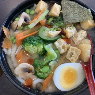 Vegetable Udon add egg. The broth is amazing and so is the chili oil. Definitely worth a try!