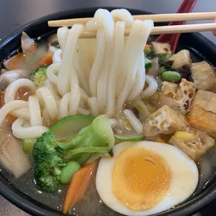 Vegetable Udon add egg. The broth is amazing and so is the chili oil! Definitely worth a try.