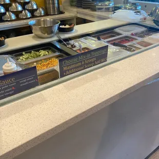 a variety of salads on a counter