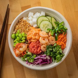 Aloha Bowl  A tropical blend of spicy salmon, tuna, shrimp, and fresh veggies with Thai chili and poke sauce. Taste the island paradise.