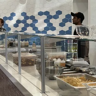 The prep area where you watch them make your poke bowl.